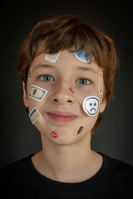 boy with stickers on face