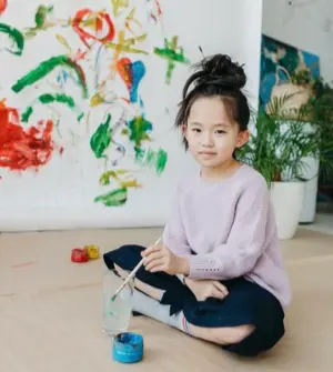 girl painting with non toxic homemade paint
