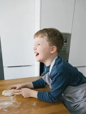  boy playing with dough