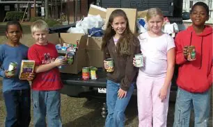 kids gathering canned goods
